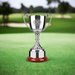 Custom Logo 11.5 inch Swatkins Endurance Cup trophy with engraved wooden base for golf tournament awards.
