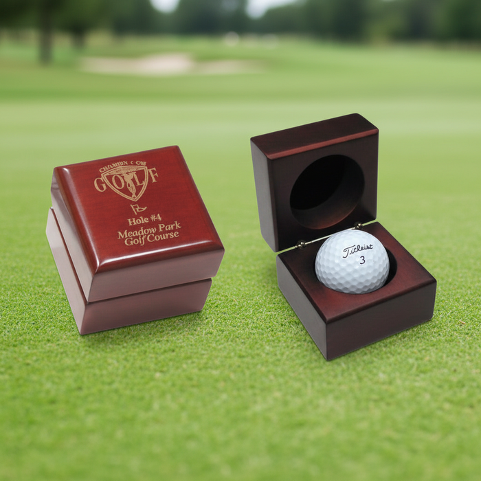 Custom engraved wooden golf ball collector display box with felt-lined interior for golf tournament awards and commemorative gifts.